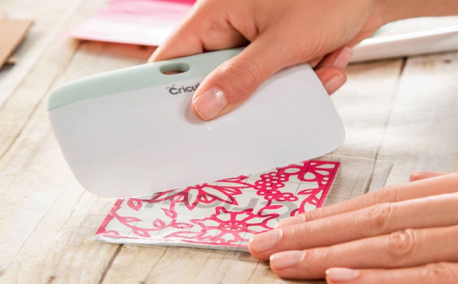 A Person Holding Cricut XL Scraper