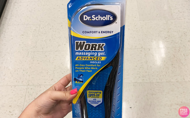 A Person Holding Dr Scholls Work Massaging Gel Insoles