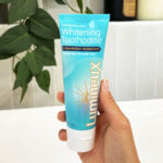 A Person Holding Lumineux Whitening Toothpaste 2 pk