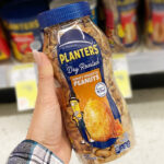 A Person Holding Planters Honey Roasted Peanuts