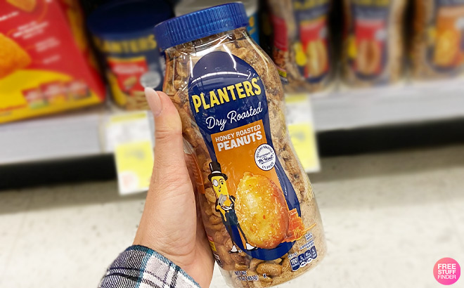 A Person Holding Planters Honey Roasted Peanuts