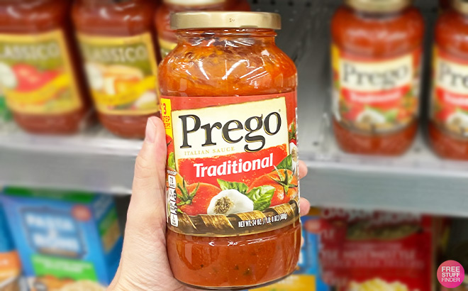 A Person Holding Prego Traditional Pasta Sauce