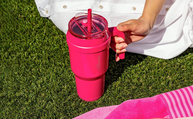 A Person Holding Reduce Cold1 Vacuum Insulated Stainless Steel Straw Tumbler Mug