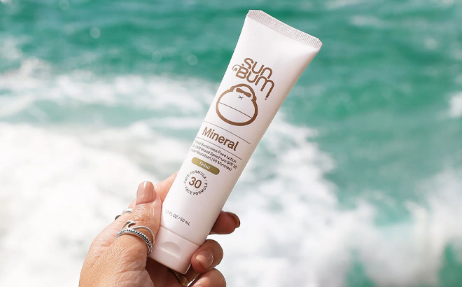 A Person Holding Sun Bum Mineral SPF 30 Non Tinted Sunscreen Face Lotion