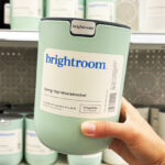 A Person Holding a Brightroom Small Desktop Wastebasket in Day Dream Green Color