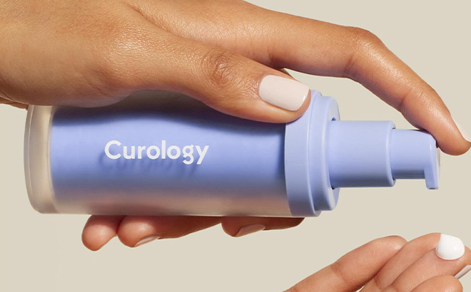 A Person Holding a Curology Skincare Bottle