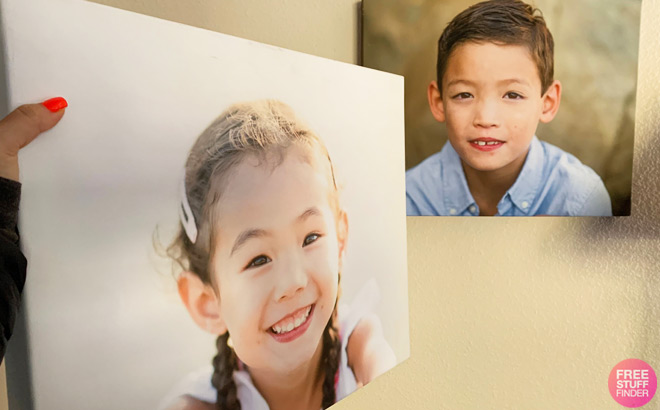 A Person Holding a Custom Canvas Print Second Canvas Print Hanging on the Wall