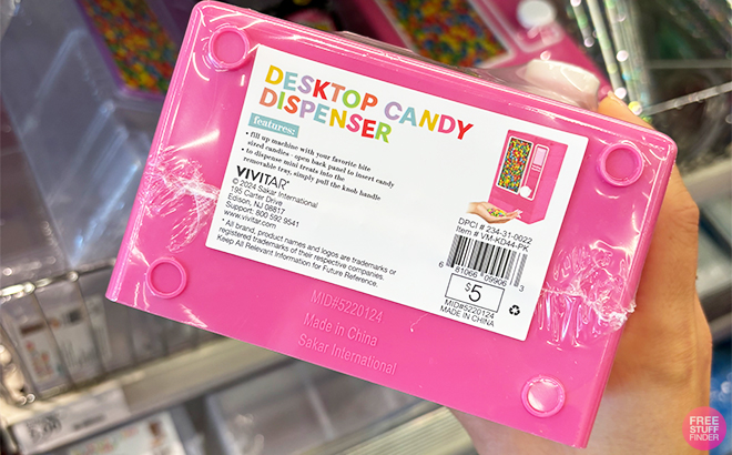 A Person Holding a Desktop Candy Dispenser Price Tag at Target