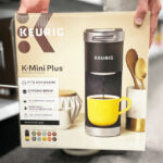 A Person Holding a Keurig K Mini Plus Coffee Maker