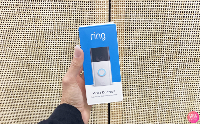 A Person Holding a Ring Video Doorbell