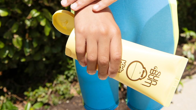 A Person Holding a Sun Bum Kids SPF 50 Sunscreen Lotion