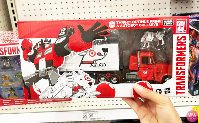 A Person Holding a Target Transformers Optimus Prime and Autobot Bullseye Action Figures Set