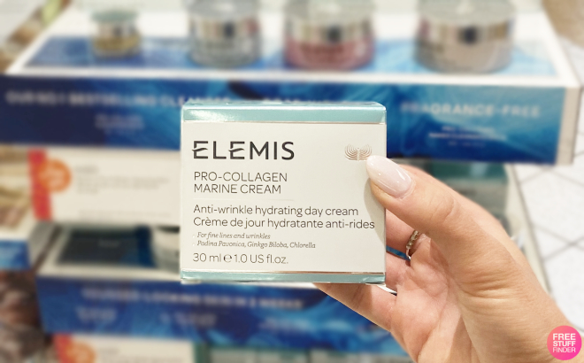 A Person Holding an Elemis Pro Collagen Marine Cream