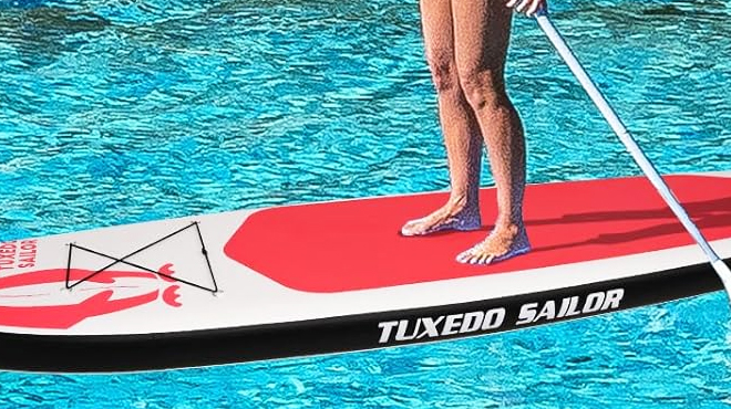 A Person Standing Up on Tuxedo Sailor Inflatable Paddle Board