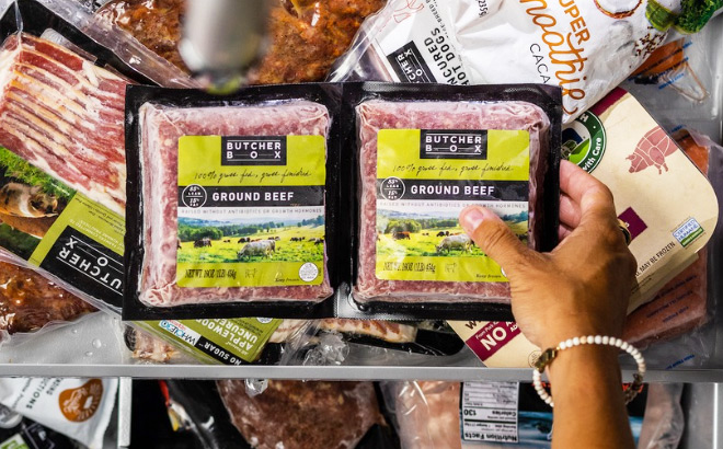 A Person Taking ButcherBox Ground Beef from a Freezer