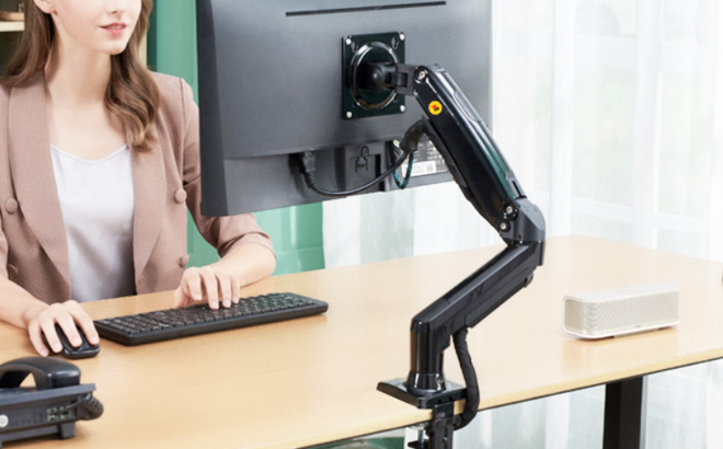 A Person Using a Monitor Mount with Swivel Arm