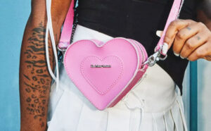 A Person Wearing Dr Martens Mini Heart Shaped Leather Bag