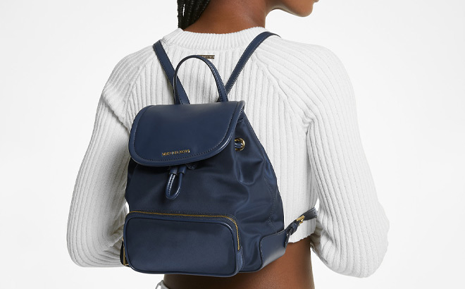 A Person Wearing Michael Kors Cara Small Nylon Backpack