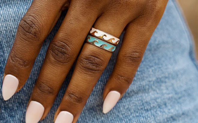 A Person Wearing Pura Vida Reversible Enamel Wave Ring