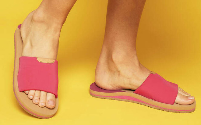 A Person Wearing Toms Carly Pink Jersey Slide Sandal