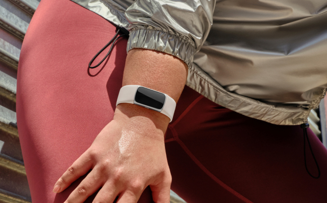 A Person Wearing a Fitbit Charge 6 Fitness Tracker