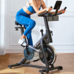 A Person Working Out at Home on a Merach Exercise Bike