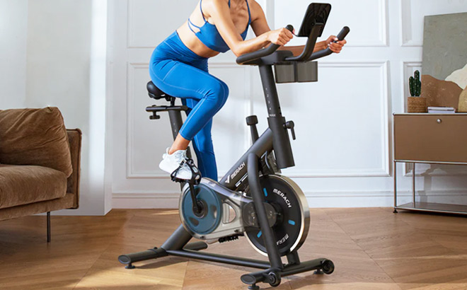 A Person Working Out at Home on a Merach Exercise Bike