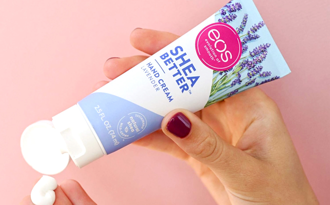 A Person holding Eos Shea Better Lavender Hand Cream