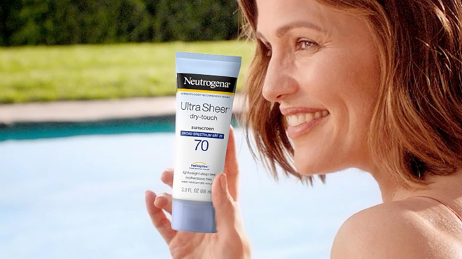 A Person holding Neutrogena Ultra Sheer Dry Touch Sunscreen Lotion