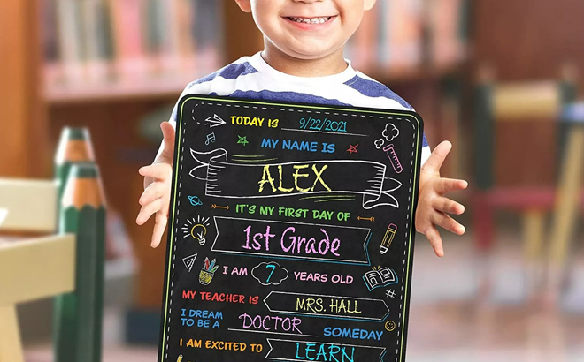 A Person holding a Double sided Kids Chalkboard