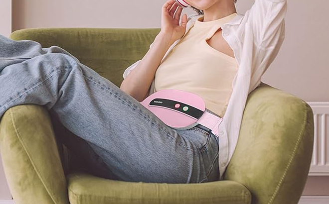 A Person using Cordless Heating Pad on their Stomach