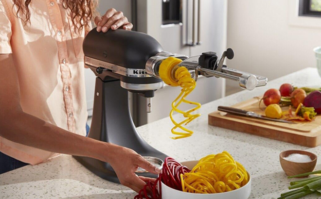 A Person using KitchenAid Stand Mixer with Spiralizer Attachment