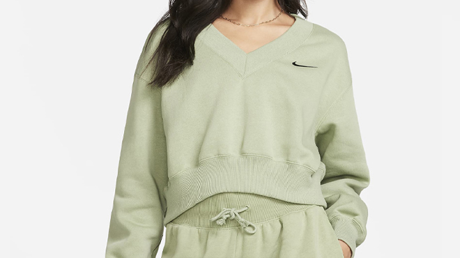 A Person wearing Nike Womens Cropped V Neck Top