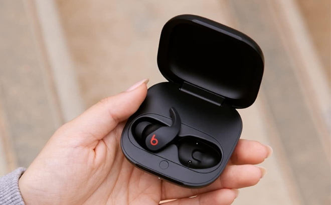 A Woman Holding Beats Fit Pro True Wireless Active Noise Cancelling Earbuds