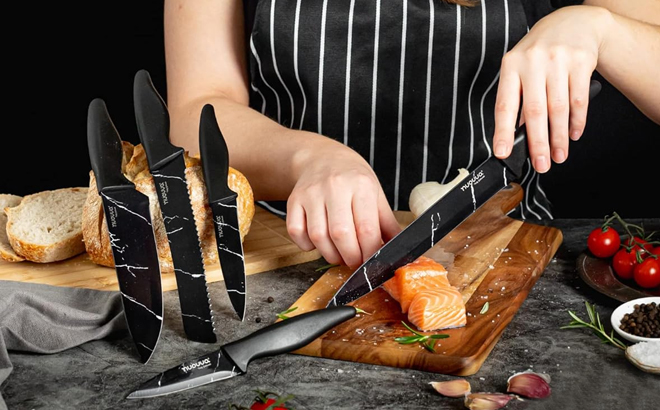 A Woman Using the Nuovva 5 Piece Professional Kitchen Knife Set