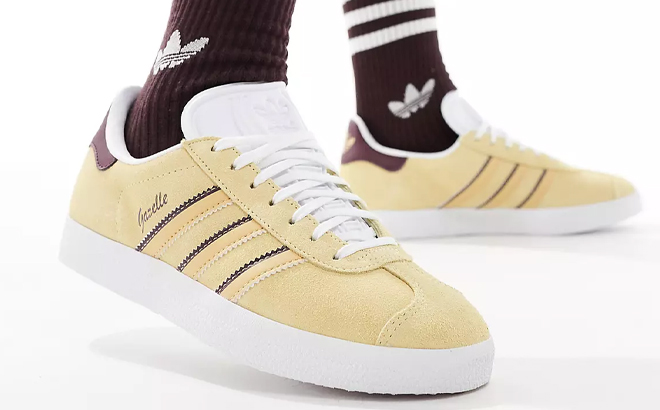 A Woman Wearing Adidas Originals Gazelle Sneakers