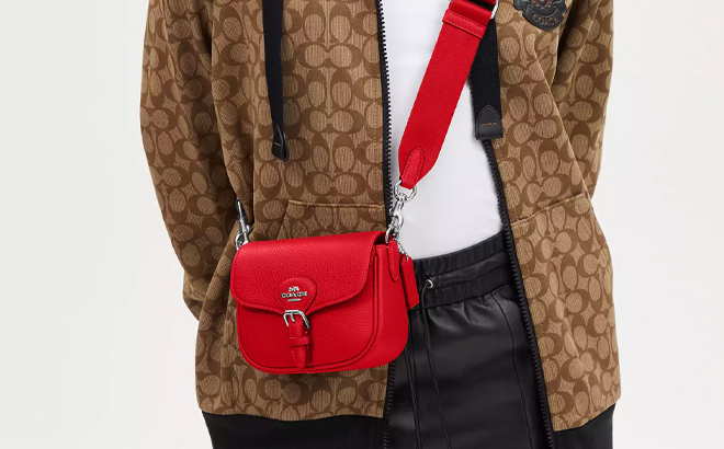 A Woman Wearing Coach Outlet Amelia Small Saddle Bag