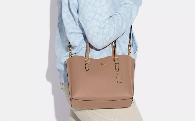 A Woman Wearing Coach Outlet Mollie Tote Bag 25