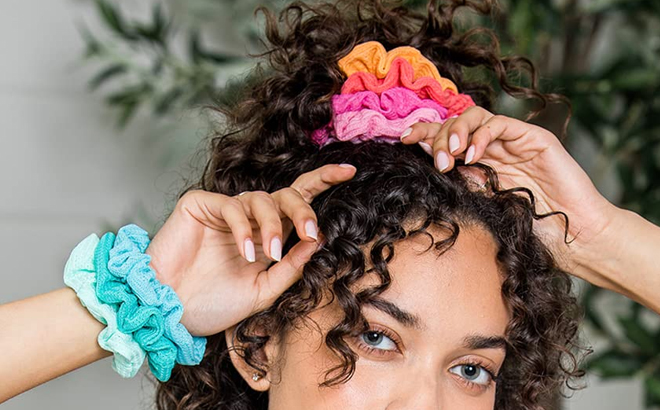 A Woman Wearing Conair Scrunchies