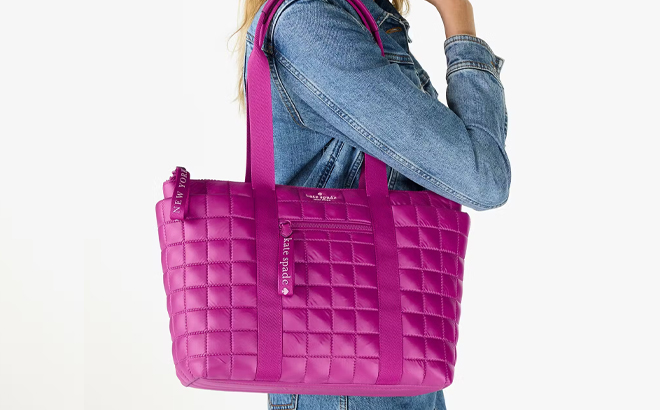 A Woman Wearing Kate Spade Camden Quilted Small Tote