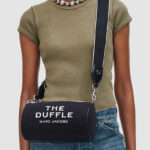 A Woman Wearing Marc Jacobs The Jacquard Duffle Bag