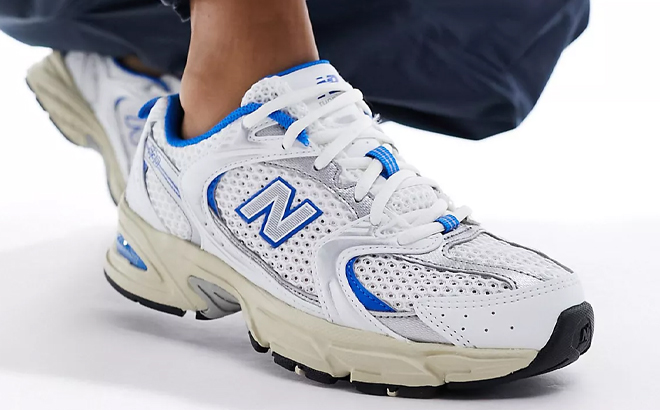 A Woman Wearing New Balance 530 Shoes in White and Blue