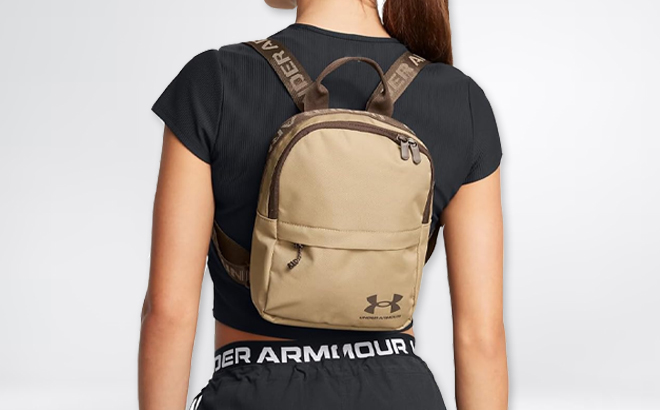 A Woman Wearing Under Armour Loudon Mini Backpack