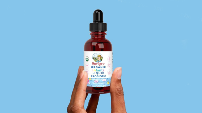 A person holding a MaryRuth Organics Infant Probiotic Drops