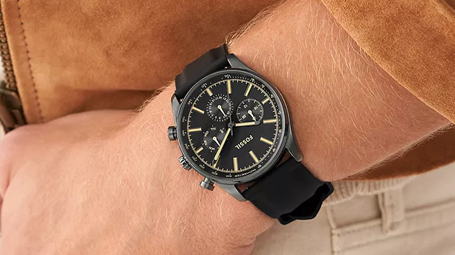 A person wearing a Fossil Sullivan Multifunction Black Silicone Watch