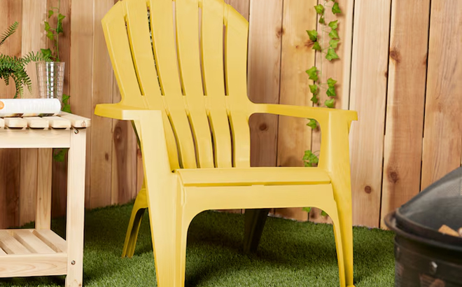 Adams Manufacturing RealComfort Stackable Yellow Plastic Frame Stationary Adirondack Chair with Solid Seat