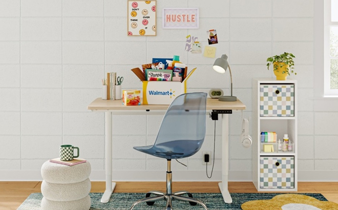An Office Desk and Chair with a Walmart Box Filled with Products on the Table