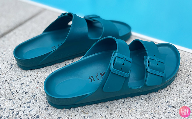 Blue Birkenstock Sandals next to a Pool