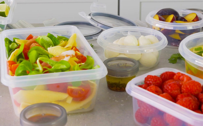 Food Storage Containers on a Table with various Food in them