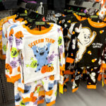 Glow in the Dark Halloween Pajama Sets on Hangers in a Store